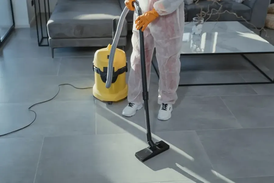 Professional restoration technician extracting water from flooded carpet in Fairfax VA